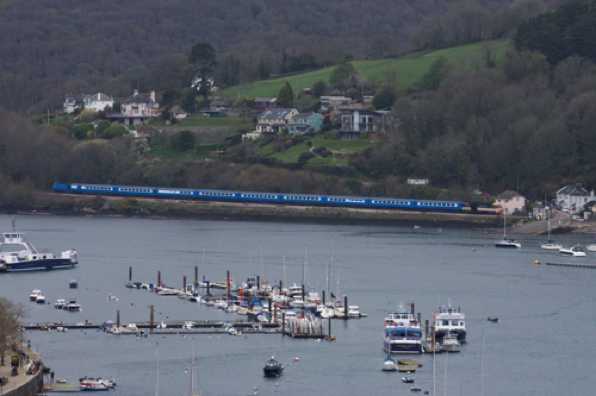 13 April 2022 - 13-36-27
The rather resplendent Devonian Pullman train arrives alongside the river Dart many hours after departing Bangor in north Wales at 5.15am. Towed by an InterCity liveried loco (number 43049) the return trip would be led by the properly painted 43046 - seen here at the back end. Keep looking to find how the entire train just about fits in Kingswear station.
----------------
Devonian Pullman arrives from Bangor